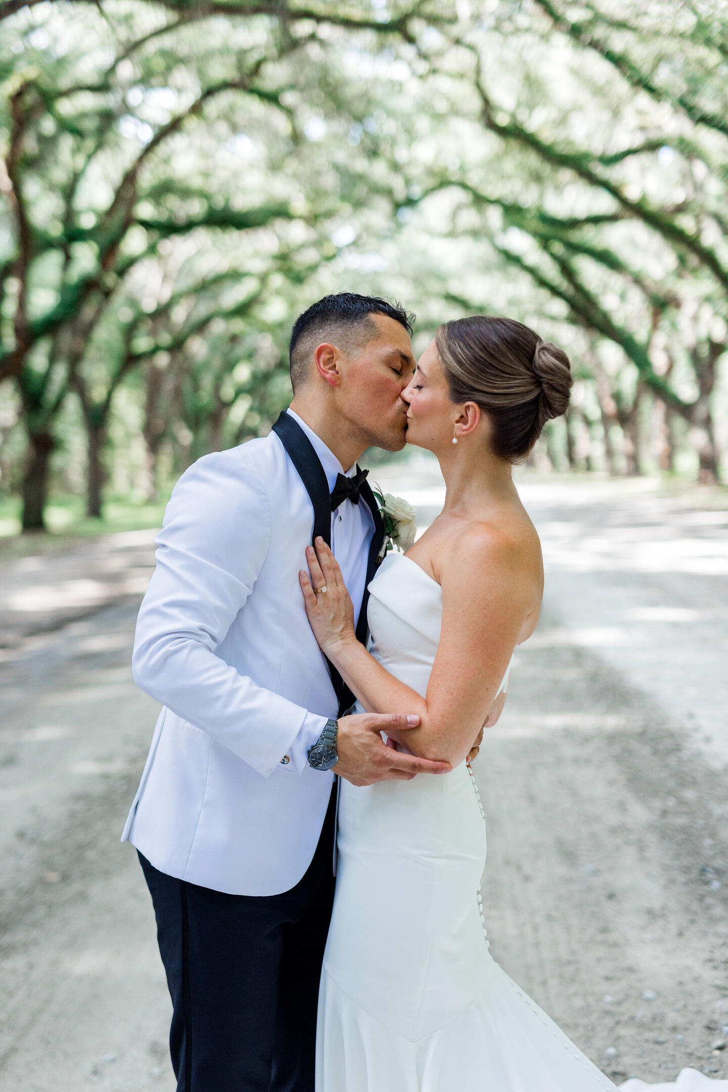 Beach wedding ceremony with bride and groom exchanging vows, black couple,