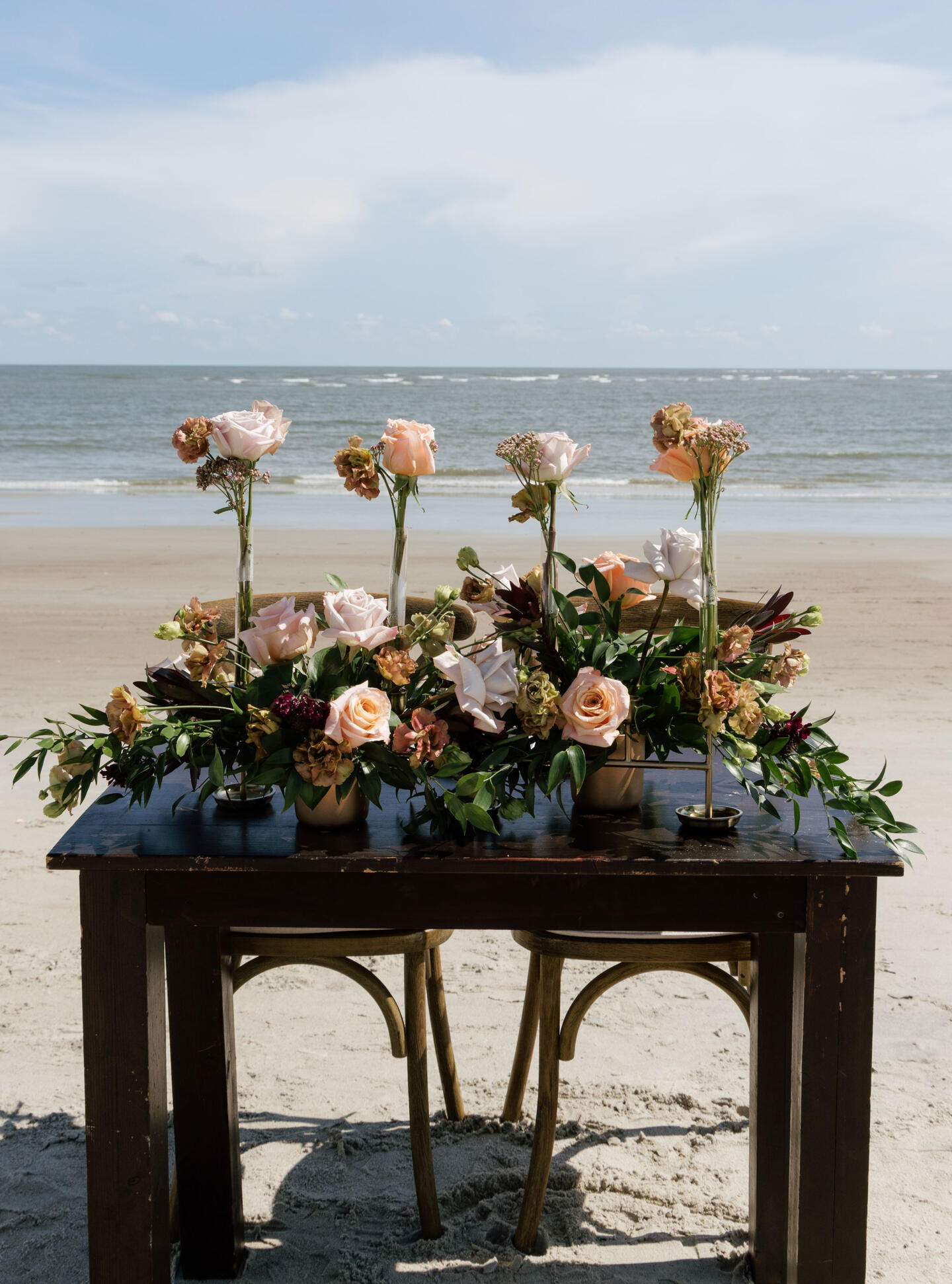 Beach wedding ceremony, flower arrangments, reception
