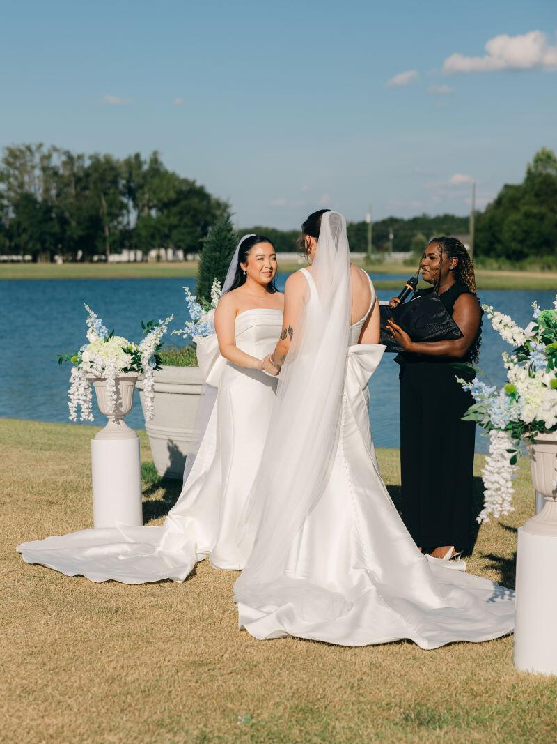Newlyweds holding hands, celebrating their wedding day in Savannah
