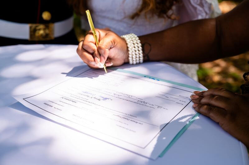 Wedding officiant signing marriage license
